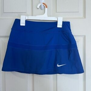 Blue Nike tennis skirt, with built in shorts. Size: Small